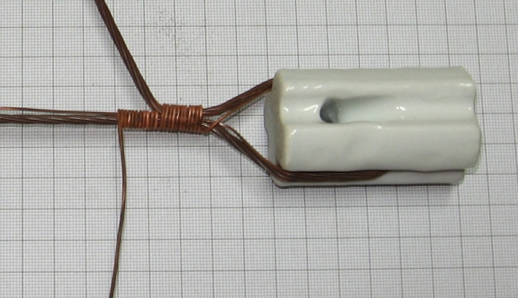 Photo#5. Continue tightly raping along the tail and sort tie for at least 10 turns.