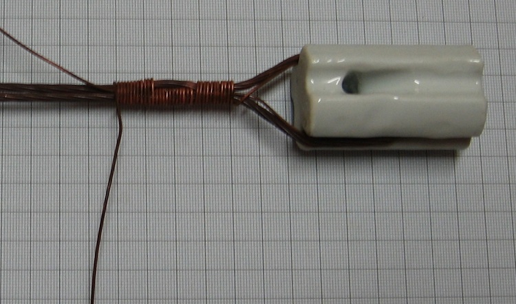 Photo#6. Form the main antenna wire and tail together and continue tightly raping for at least 10 turns.