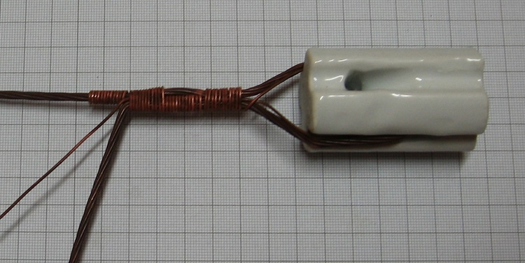 Photo#7. Bend the tail and short tie wire away as above and continue tightly raping for at least 10 turns.