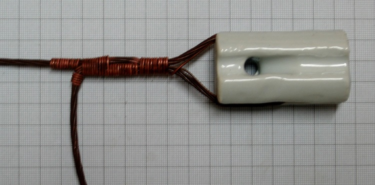 Photo#8. Rap the short end of the tie along the tail for approximately 3 to 5 turns as above.